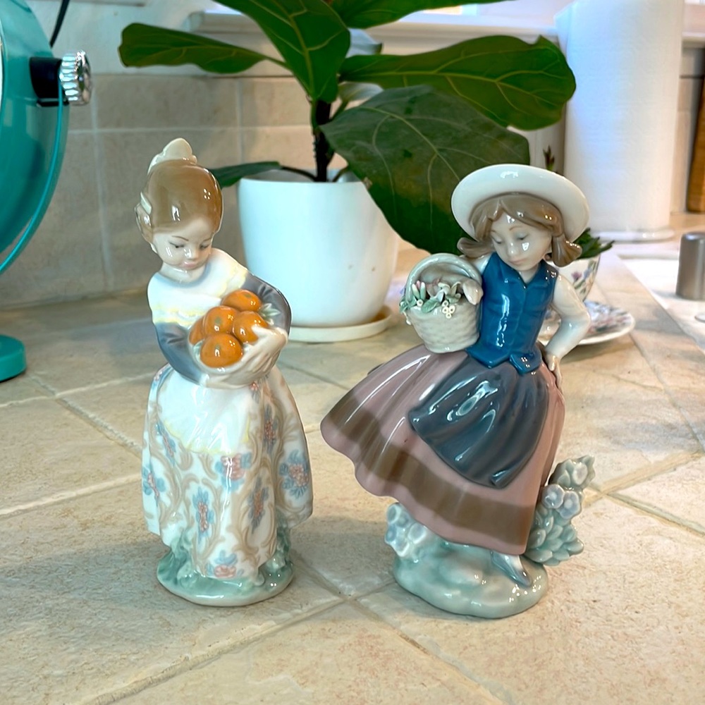 Lladro figurines #5221 sweet scent $100 #4841 Valencian girl $75 or 150 for both